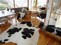 Gorgeous Creatures Cowhide Rugs & Ottomans image 1